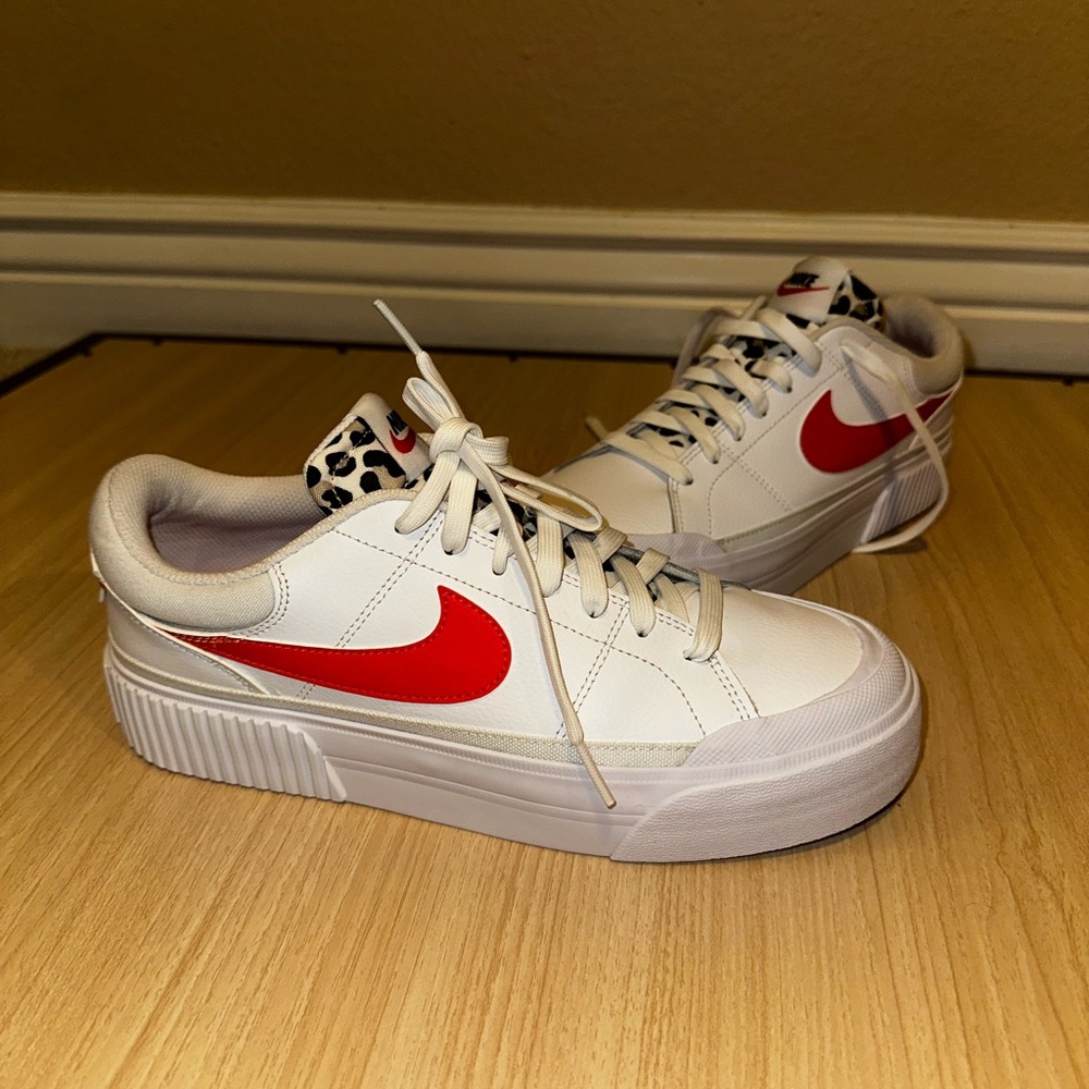 Nike Women's White Sneakers with Red Swoosh